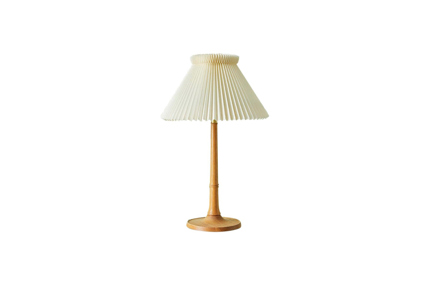on the table is the vintage le klint oak table lamp, available for  alt=