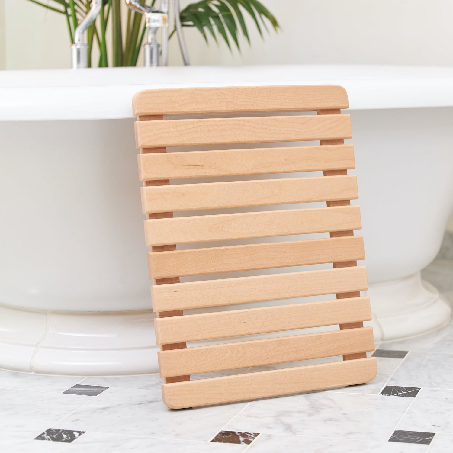 from avocado, the wooden bath mat has rounded corners and is made of beech; $ 14