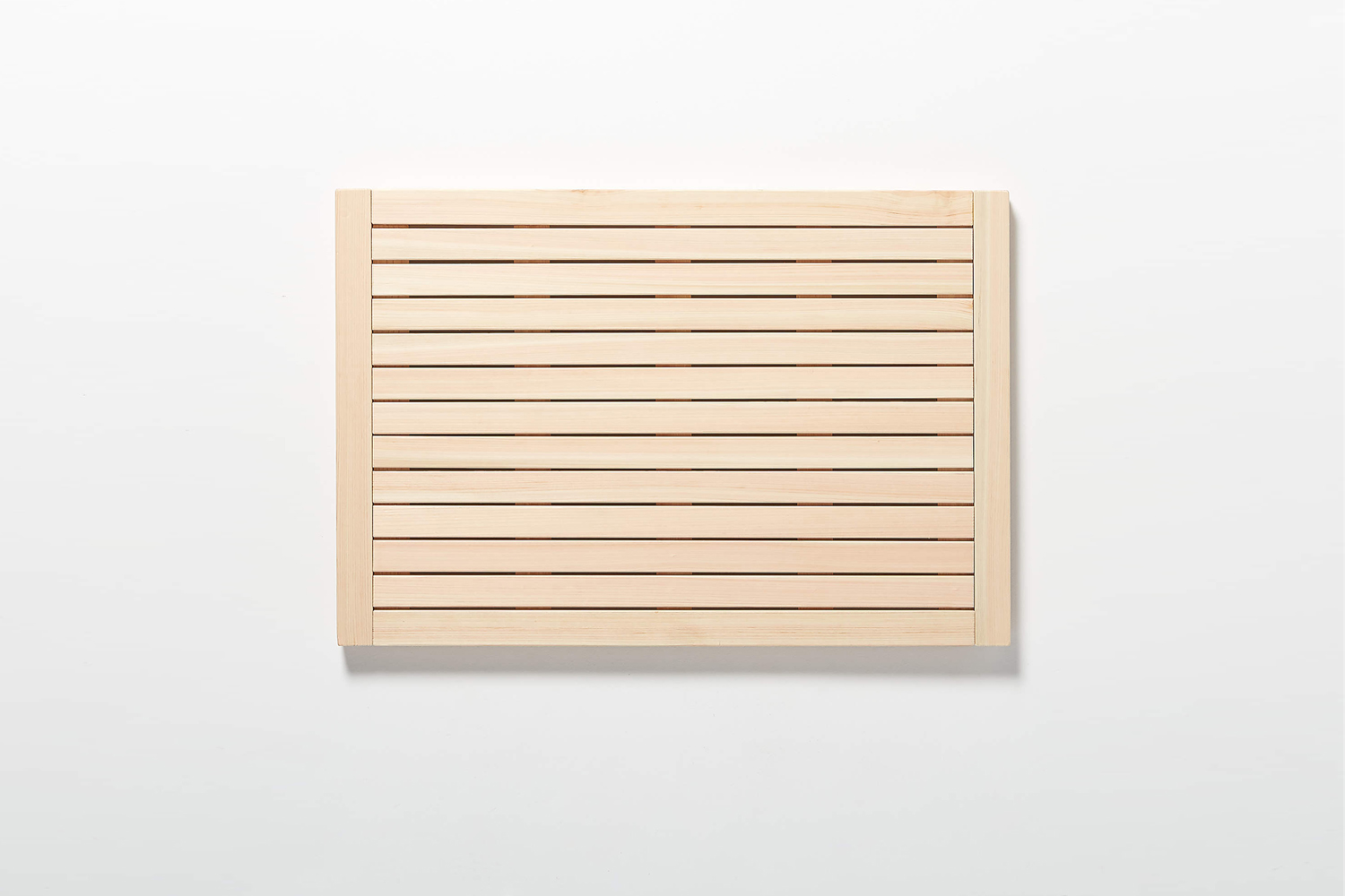 the lateral hinoki wood bath mat from cb2 comes in two sizes: small for .9 11
