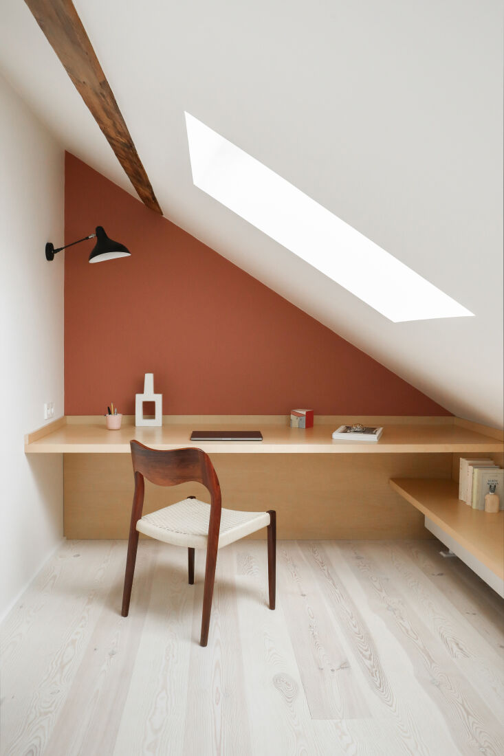 in a paris duplex by heju, an efficient built in work area is slotted in under  14