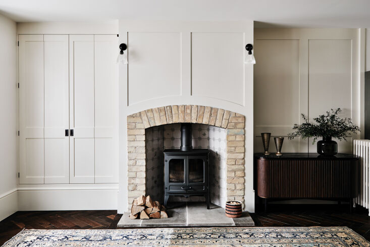 the room&#8\2\17;s re created fireplace has a surround of reclaimed suffolk 16