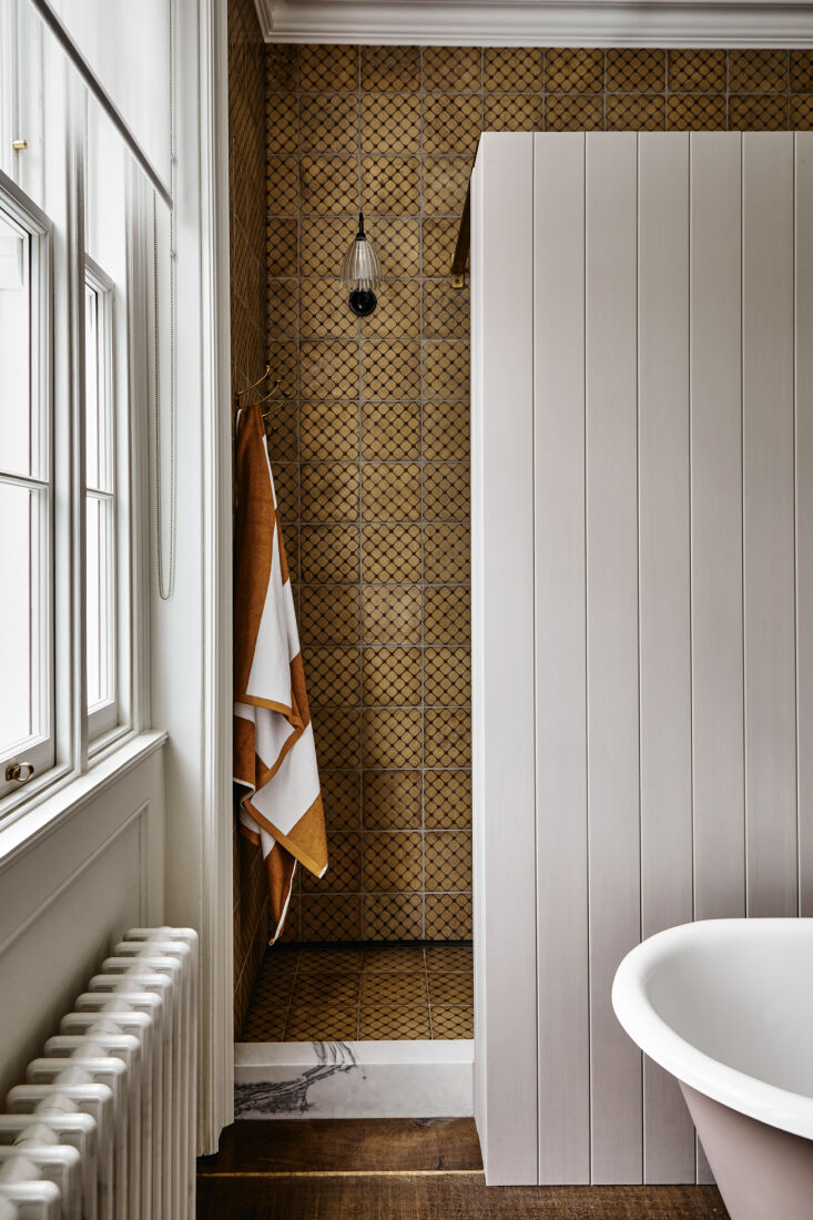 reclaimed spanish tiles cover the shower area from floor to ceiling. 28
