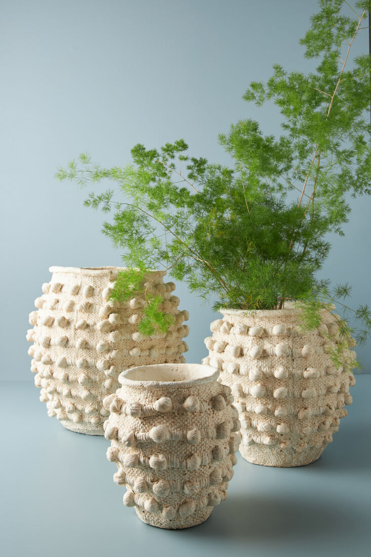 above: hand painted cement minka textured pots are best delivered filled with f 12