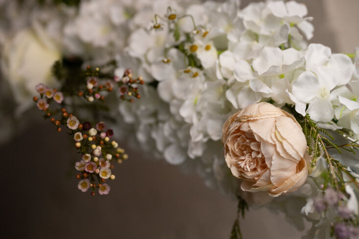 a detail of the faux hydrangeas mixed with fresh stems. for sourcing ideas, see 17