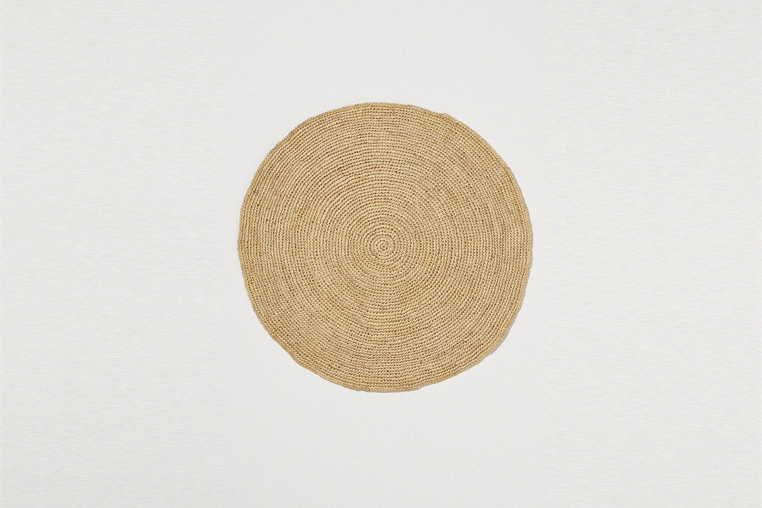 from toast, the raffia placemat in natural is £\16. 21