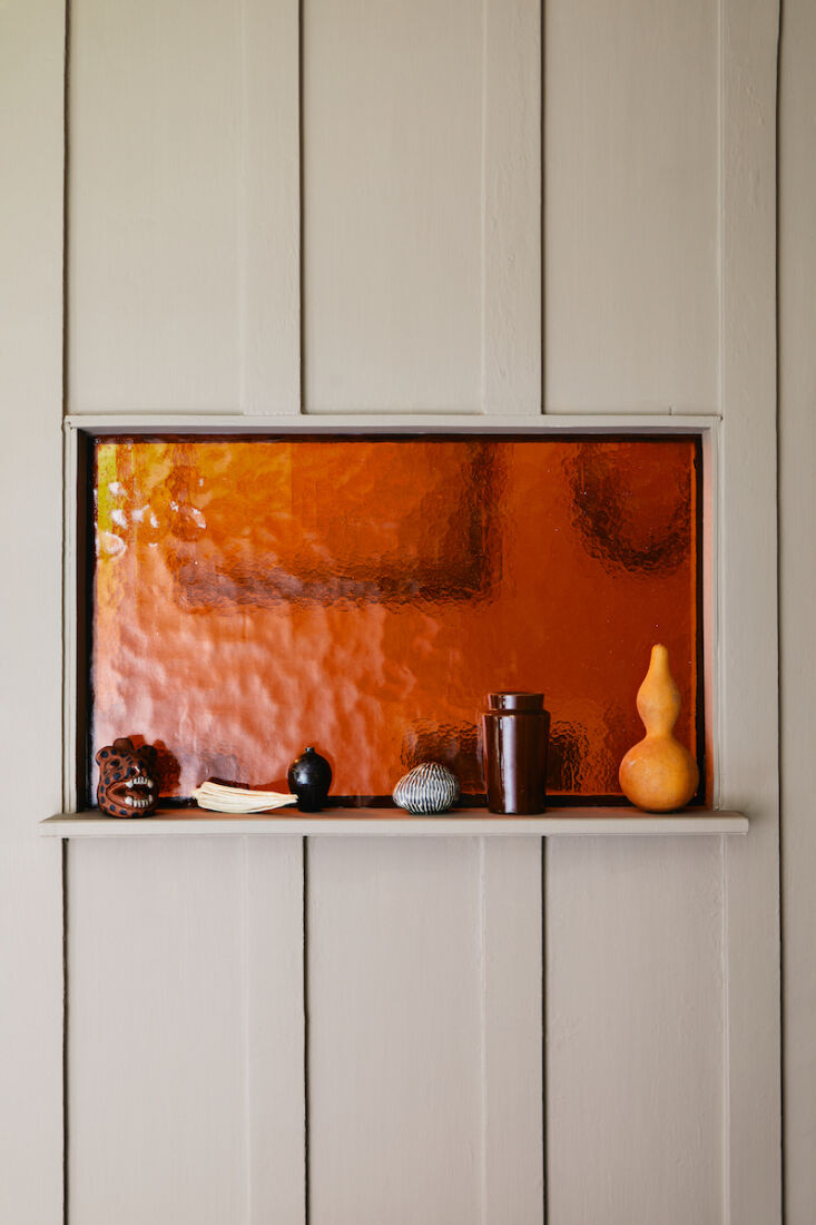inspired by cathedrals, lucy added a pane of tinted glass above the doorframe a 17