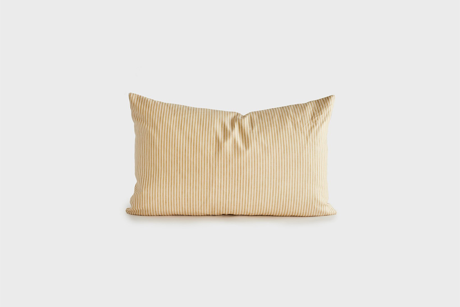 the apricot and cream striped lumbar pillow is \$375 at sunday shop. 23
