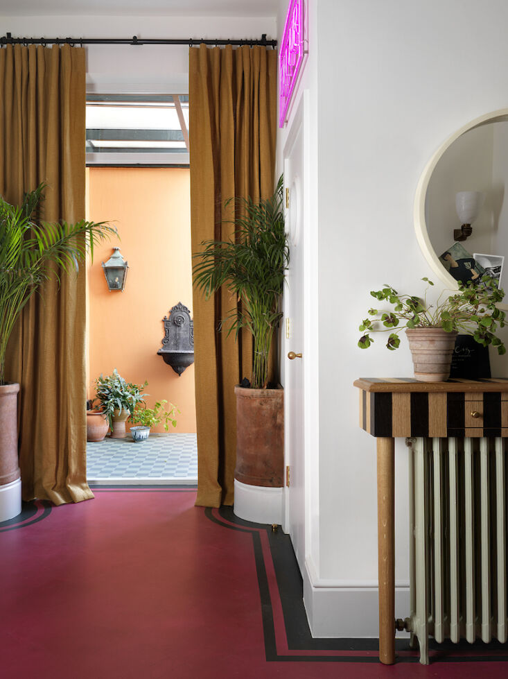 on the ground floor, a laminate parquet floor was painted fuchsia pink and knoc 17