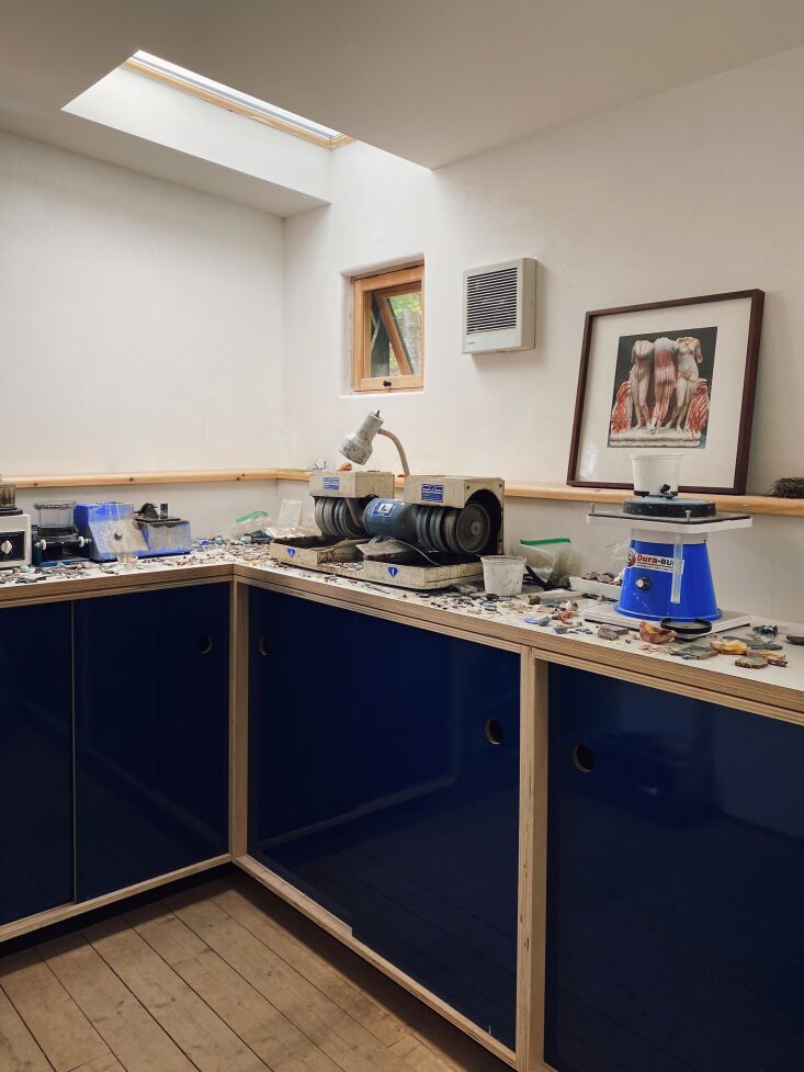 kate&#8\2\17;s workbench features custom cobalt blue cabinetry.&#8\2\2\ 14