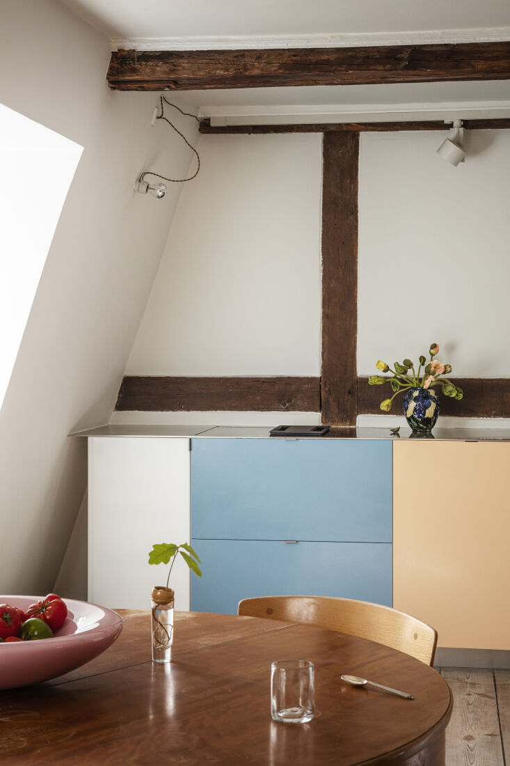 the apartment&#8\2\17;s exposed beams are original. the cooktop is an induc 14