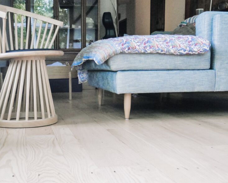 oak floors with benchmade modern sofa and tom dixon fan chair via lightology