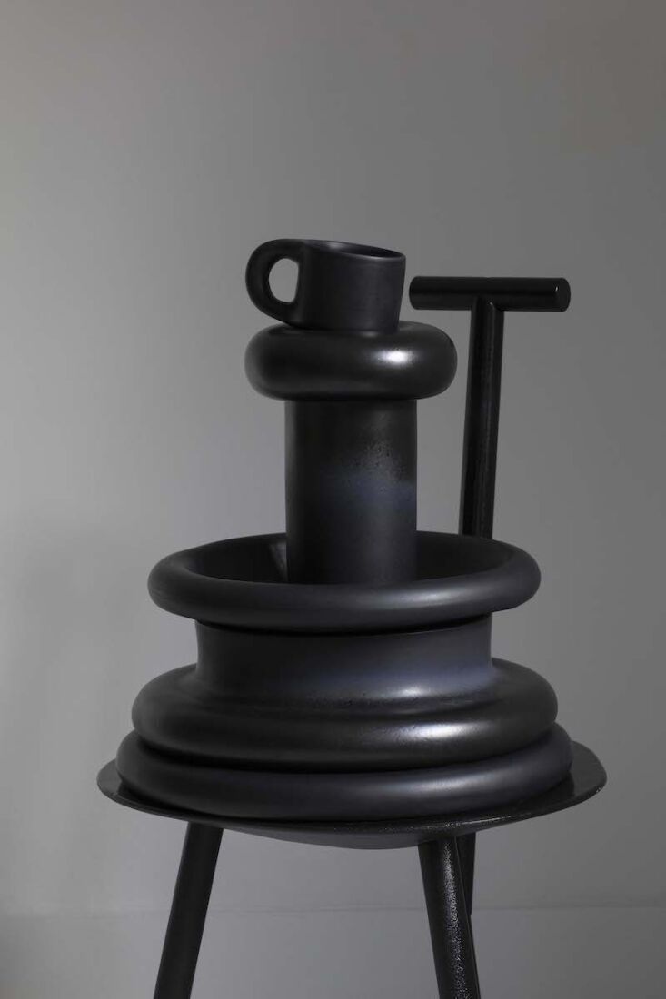 a stack of dough ceramics in charcoal, balanced on toogood&#8217;s spade  13