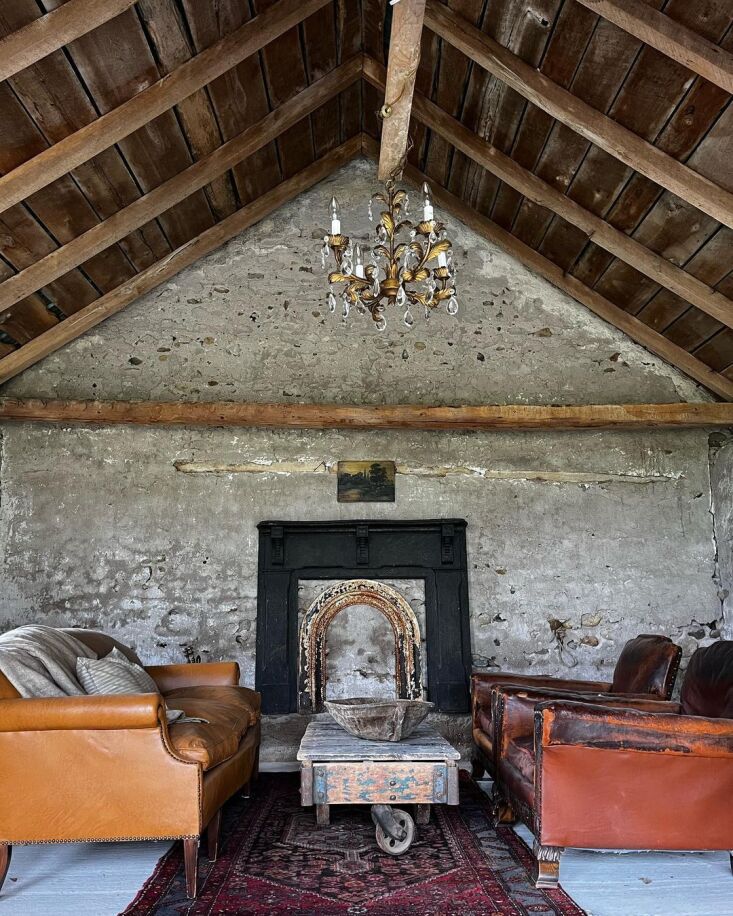 another building, the stone barn, has original stone walls and high wooden beam 18