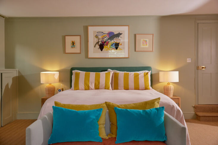 the walls in this bedroom are painted verre de terre by farrow & ball. the  13
