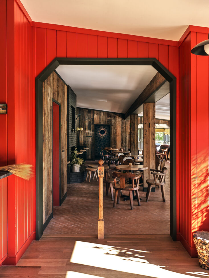 wood paneling painted tomato red greets guests and diners at the entrance to th 11