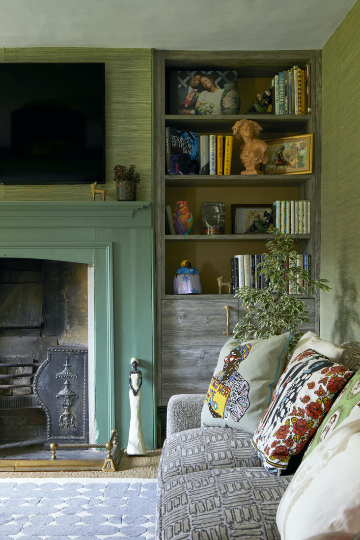 there&#8\2\17;s a working fireplace with a matching green mantel at the oth 12