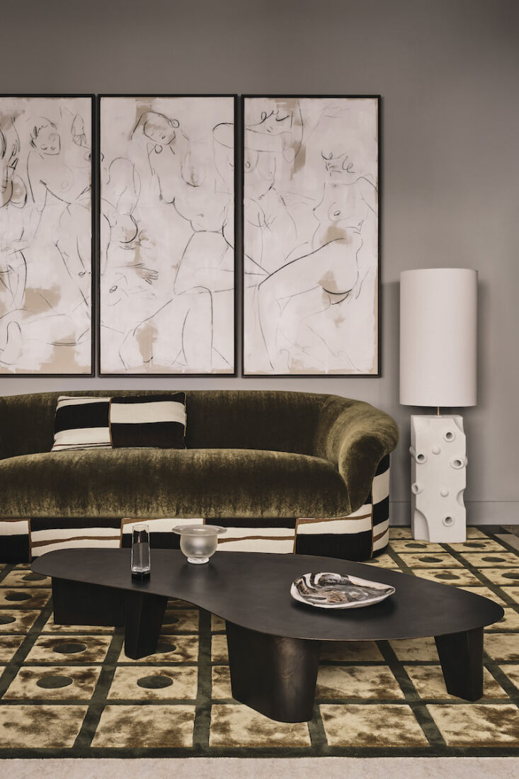 in the living area, the roll top sofa is upholstered in ‘zeppelin’ 10