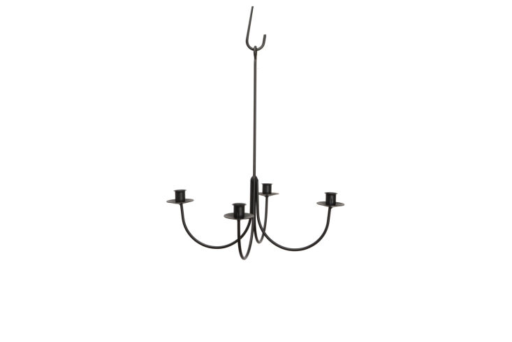The vintage candelabra was bought on a trip to Wellfleet, Massachusetts. For something very similar, the 4-Arm Wrought Iron Candle Chandelier is $74.97 at Saving Shepherd.