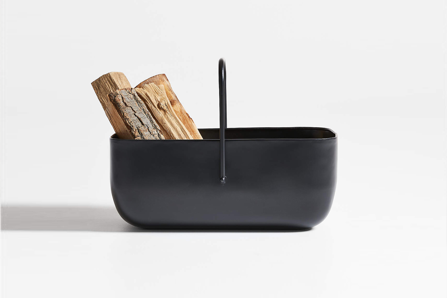 the telum black log holder, made of black iron, is \$\199 at crate & barrel. 11