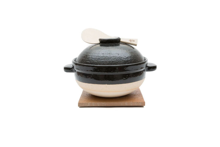 the hagatani en donabe kamadosan is designed for cooking rice to perfection; \$ 13