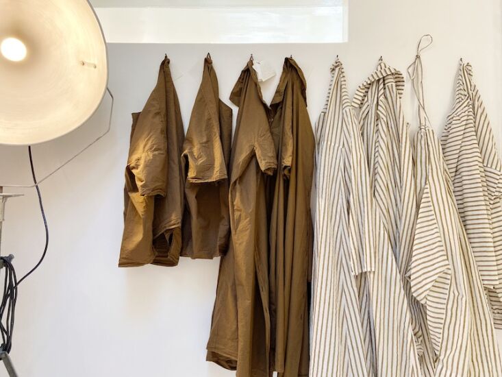 stripes and khaki, hung side by side. 13