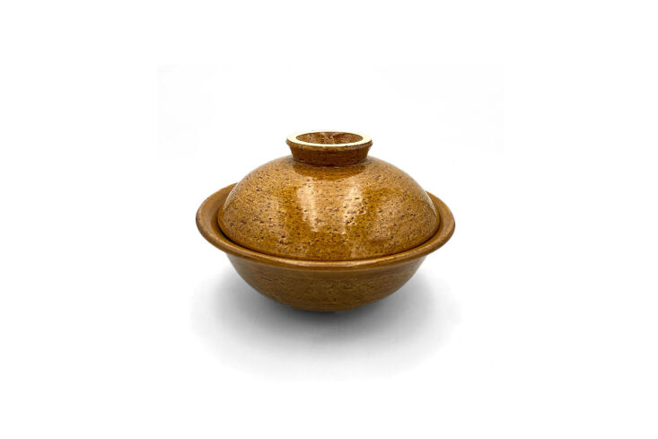 the multi purpose donburi size donabe steamer, shown in caramel, is made for a  11
