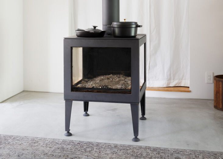 the steel wood stove is a custom design. 11