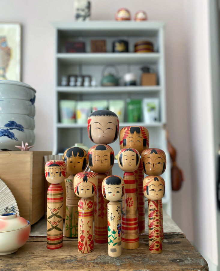 a collection of hand painted wooden kokeshi dolls from the 1950s. 15