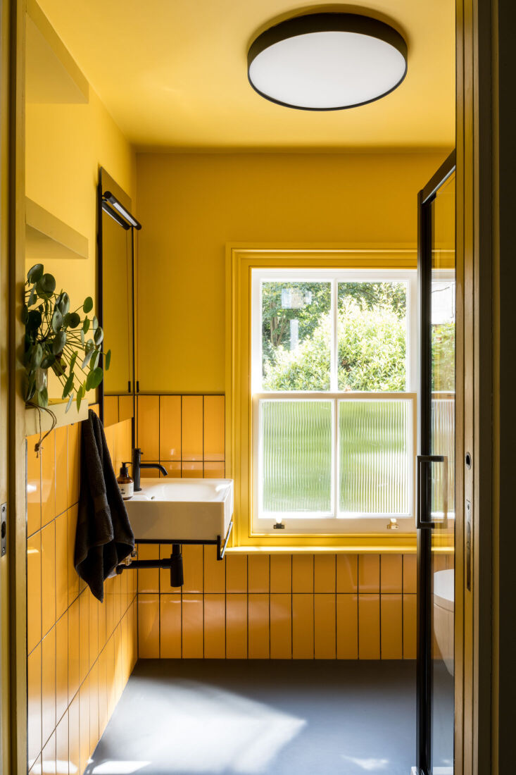 a bathroom drenched in yellow and sunlight. learn the details in steal this loo 20