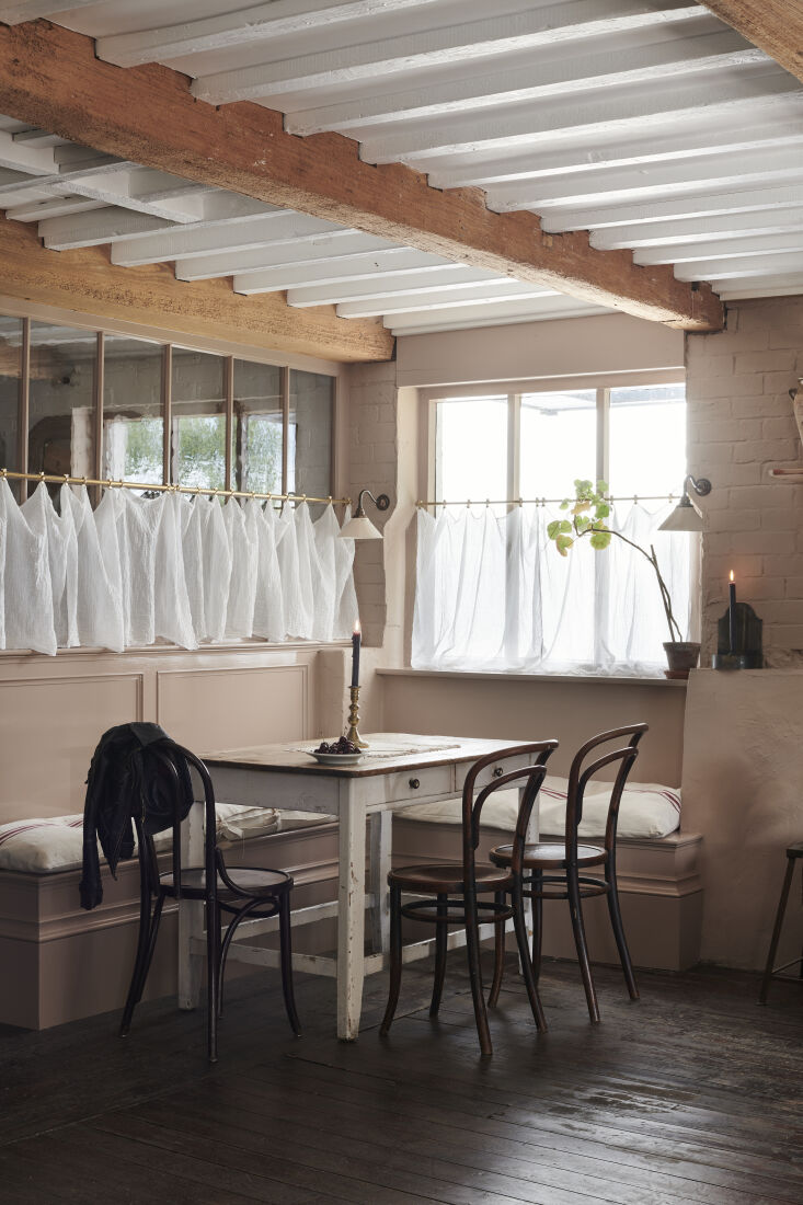 gauzy, casually draped cafe curtains sweeten a dining nook in kitchen of the we 9