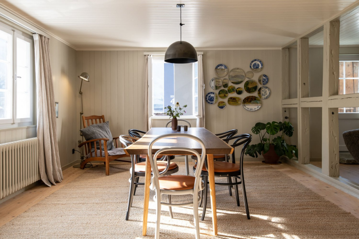 the apartment is defined by a main room split into modest dining and living sec 9