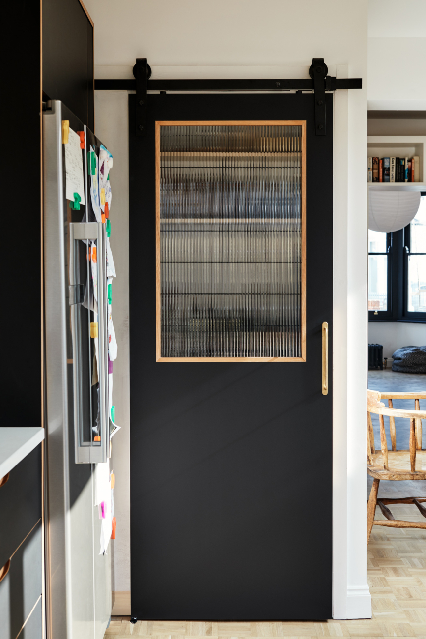 to close off the pantry, hølte designed and fabricated a sliding door inse 16