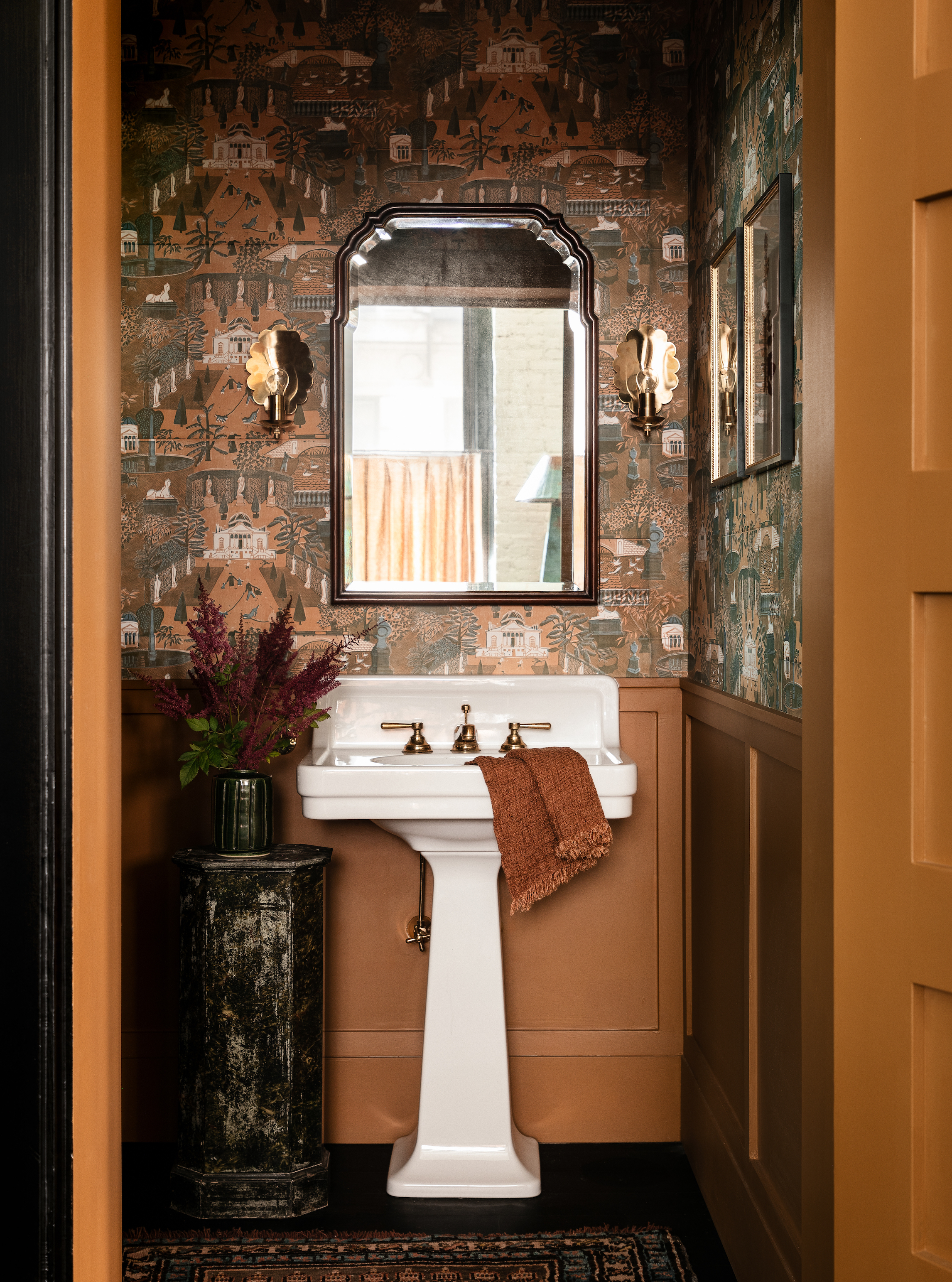 the powder room feels like stepping into a chinoiserie screen—set in the 20