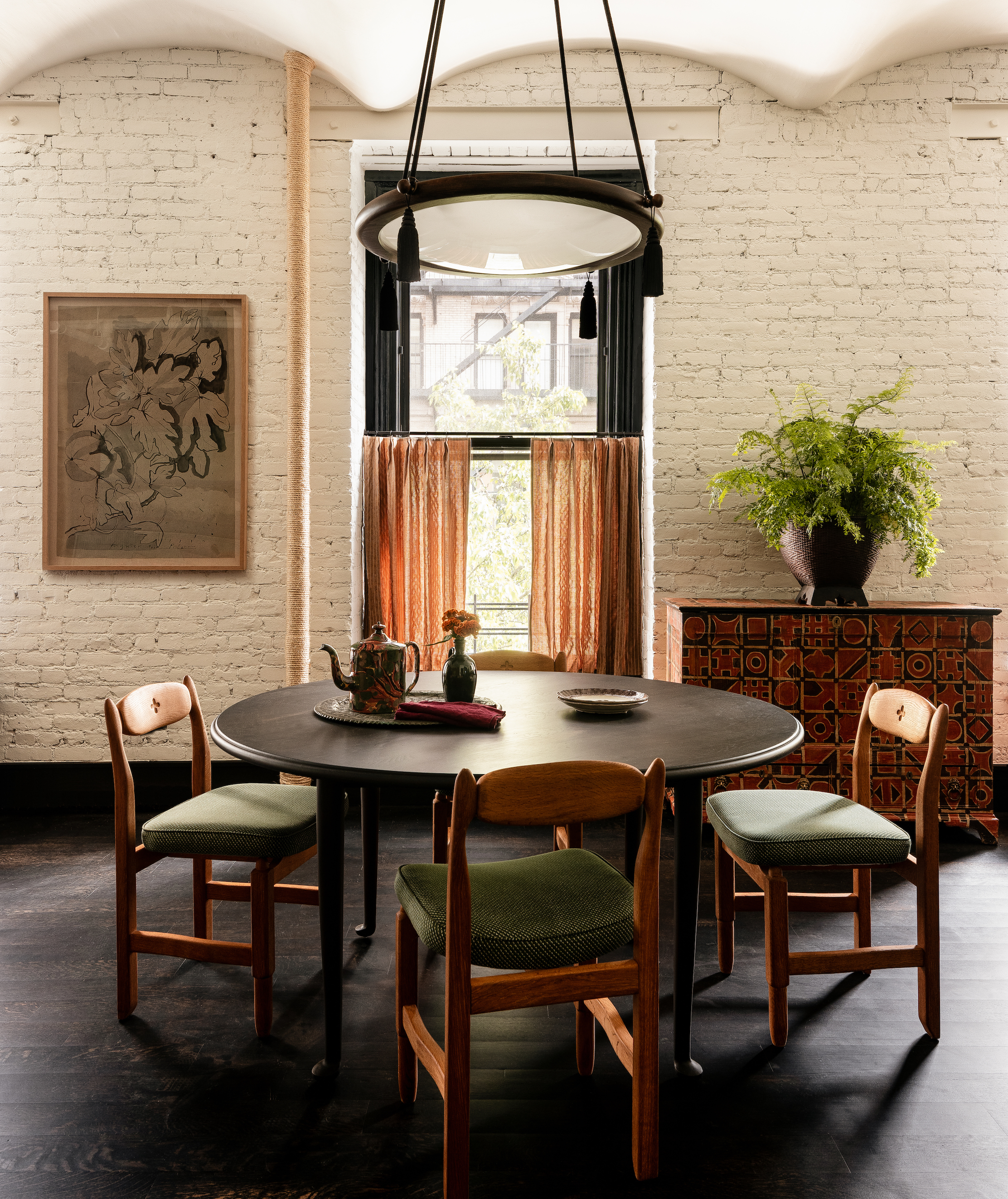 the round dining table is surrounded by midcentury french rustic luxe guillerme 12