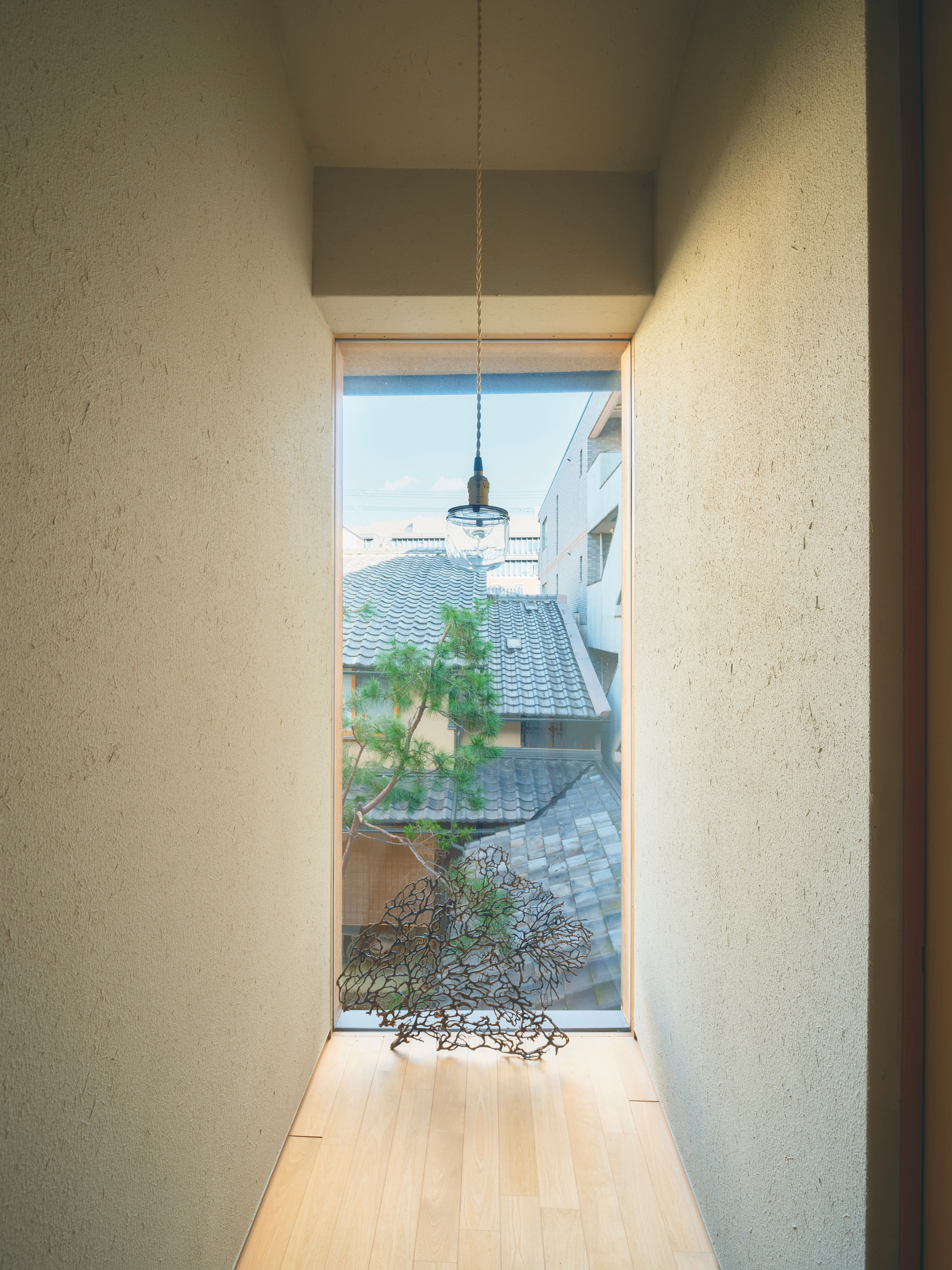 the upstairs hall ends with a courtyard view and a light from aruse. 22