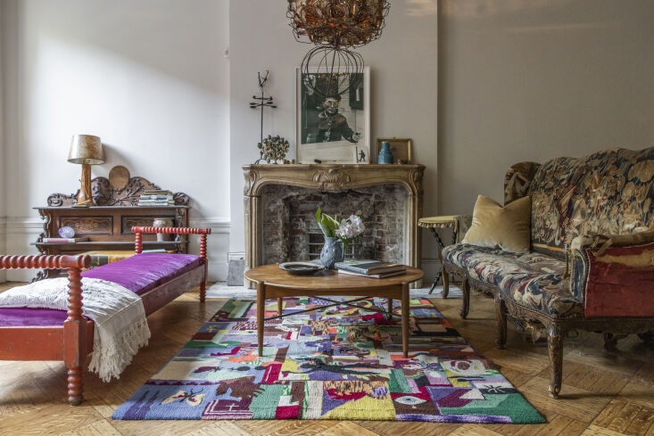 on another floor, a living area is a wild but curated mix of color, pattern, an 21