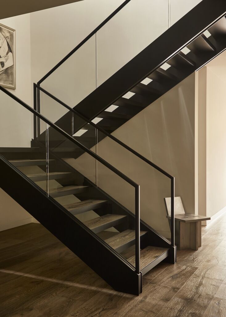 the wide floor boards and treads on the steel framed stair are french oak from  17