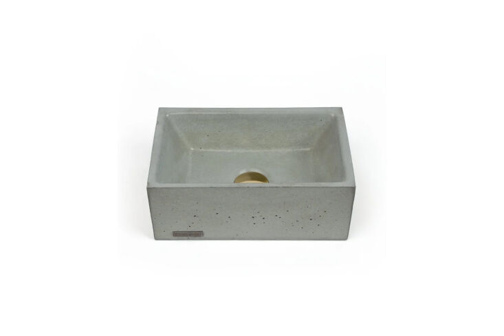 the sink is a repurposed cast concrete laundry sink saved from the original cab 14