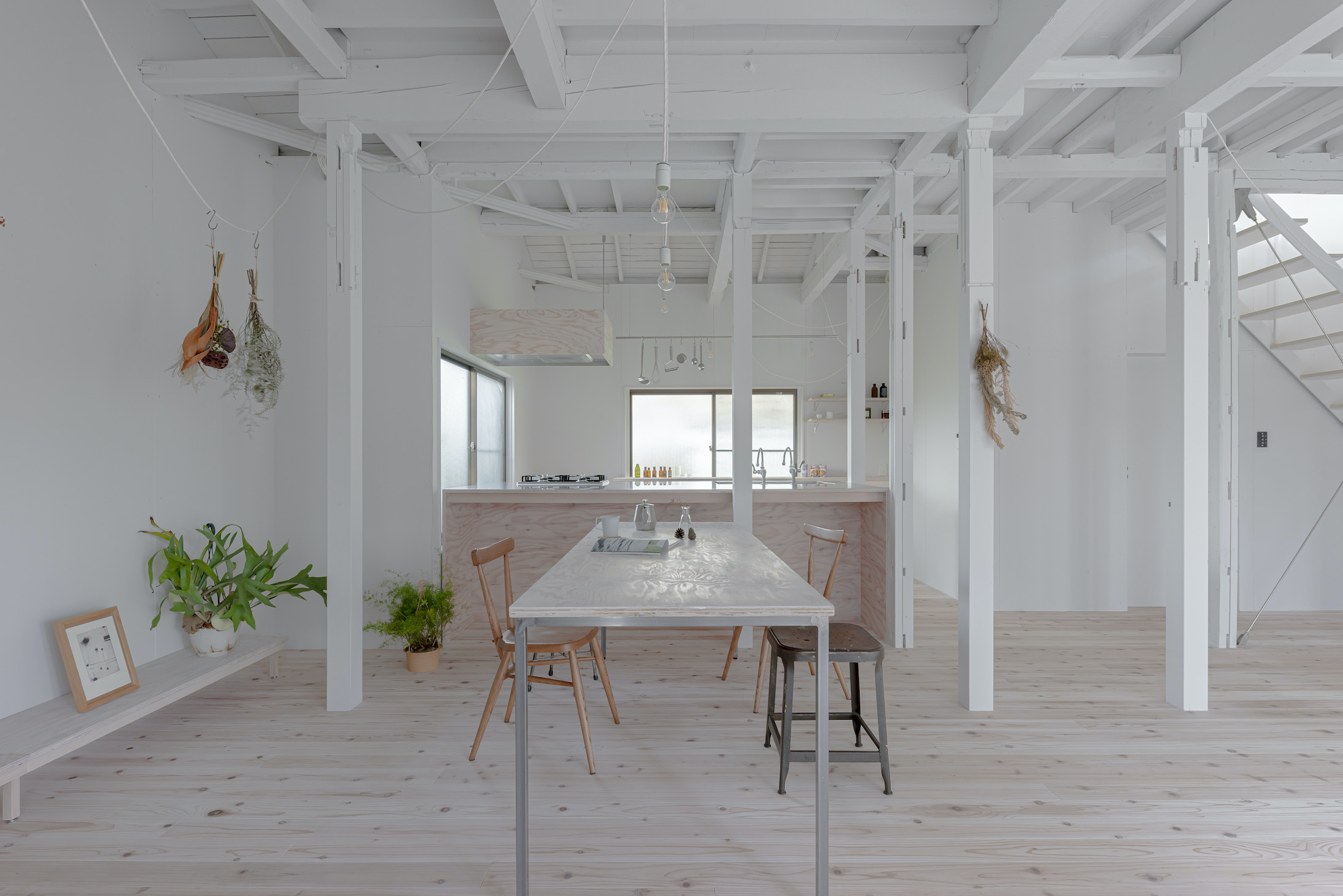the architects designed a steel framed table topped with the same larch plywood 11
