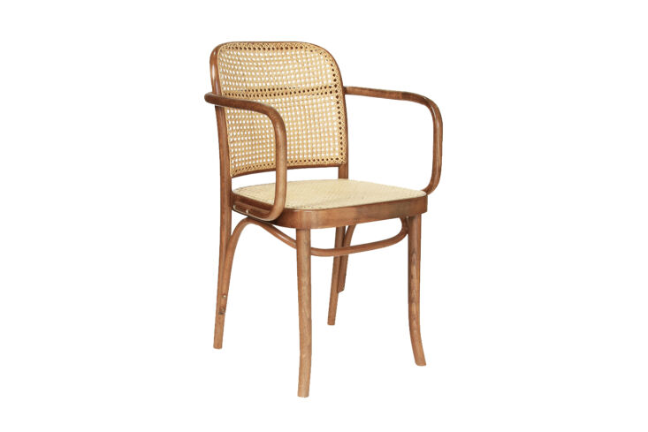 the chairs are vintage josef hoffmann caned chairs in walnut. the thonet no. 8\ 12