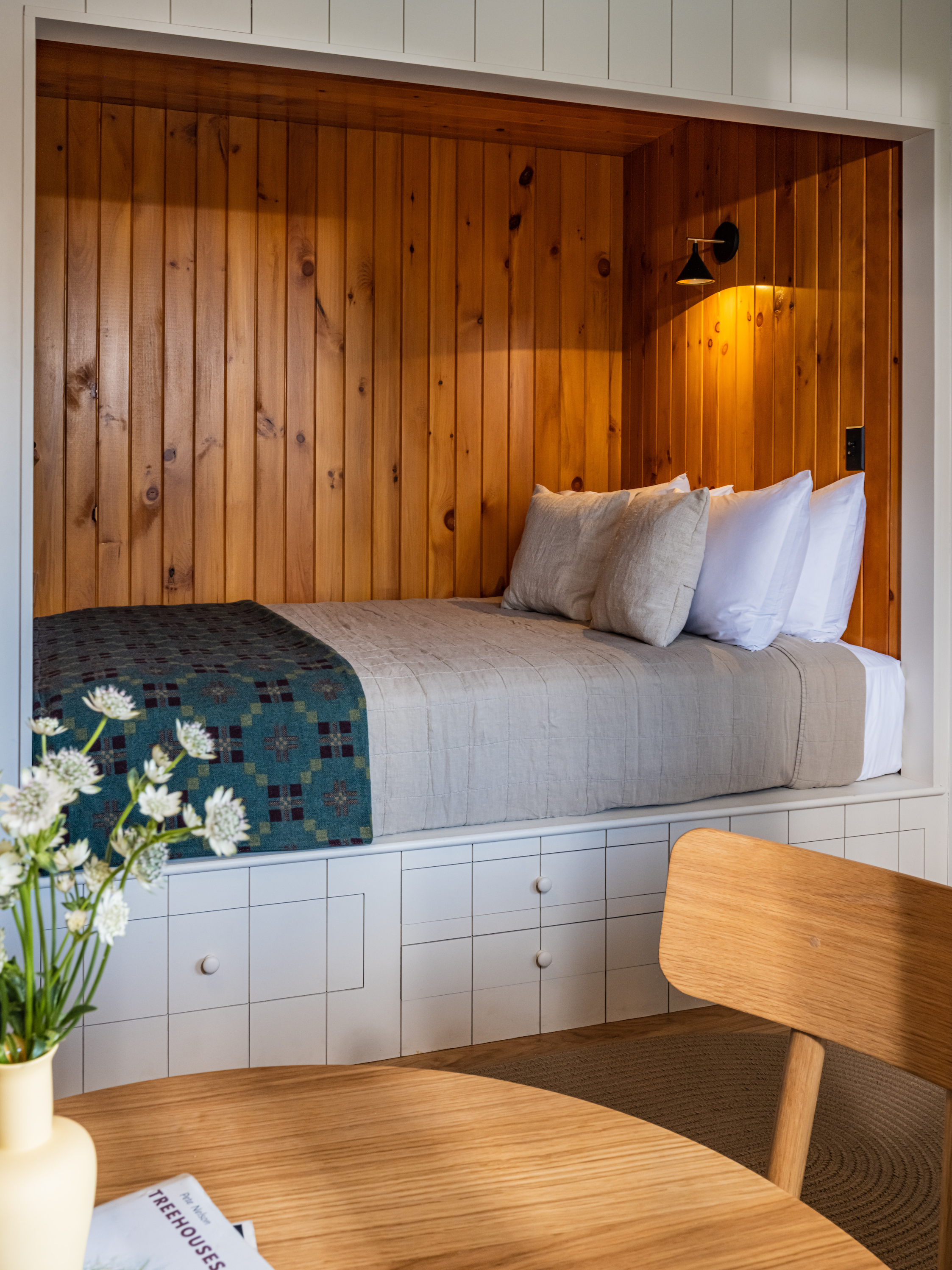 the nook in the main lodge has a queen size bed atop built in storage: &#8\ 20