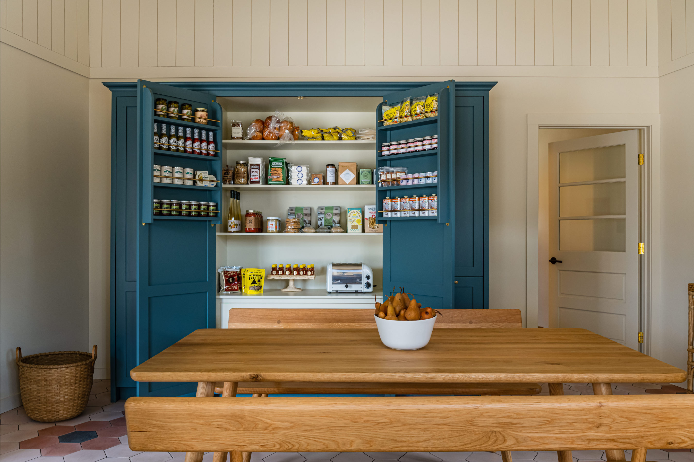 an open round the clock pantry—with cabinetry from devol in the company& 21