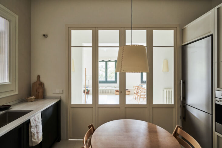 the view from the kitchen to the living/dining room. the pendant light is by sa 15