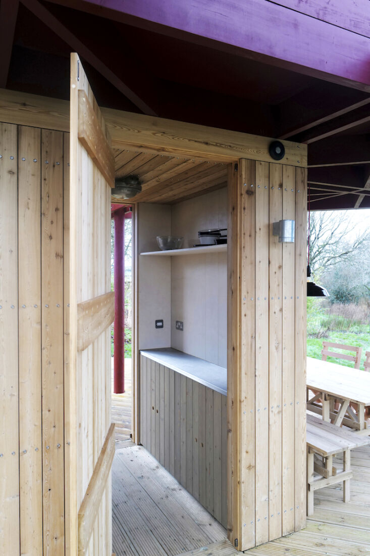 a hot shower is tucked behind the enclosed kitchen; the compost loo is a in ano 21