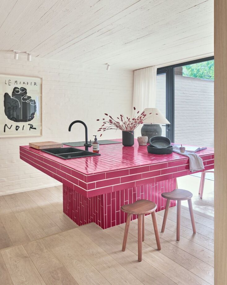 a bold hot pink kitchen island designed by jill rooijakers. photograph by peter 21