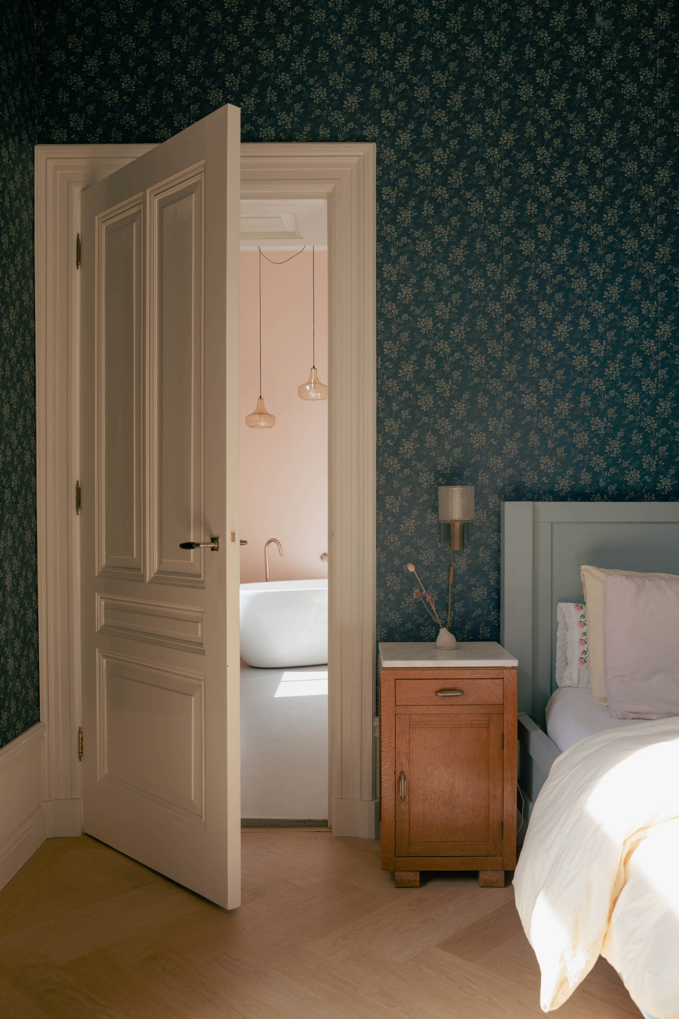 arianne and derk&#8\2\17;s room has an en suite bath and floral wallpaper f 22