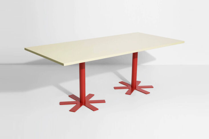 the dining table is the parrot large table in light yellow designed by india ma 15