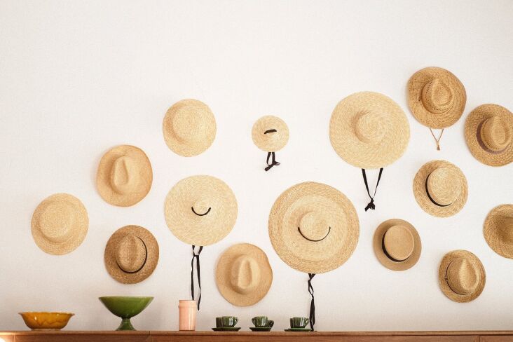 beribboned straw hats serve as decor (and bring to mind the heroine of linnea i 20