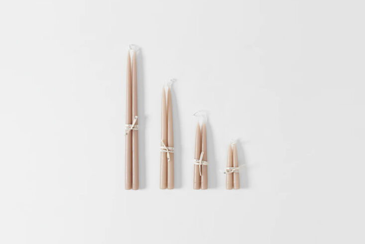the hand dipped taupe taper candles start at \$8 at march. 34