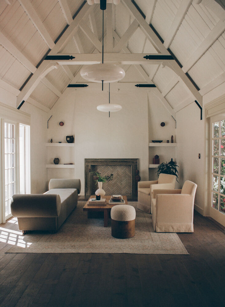 the living room—formerly painted and carpeted in shades of yellow— 13